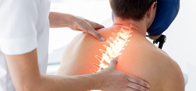 A patient with osteochondrosis is being examined by a doctor